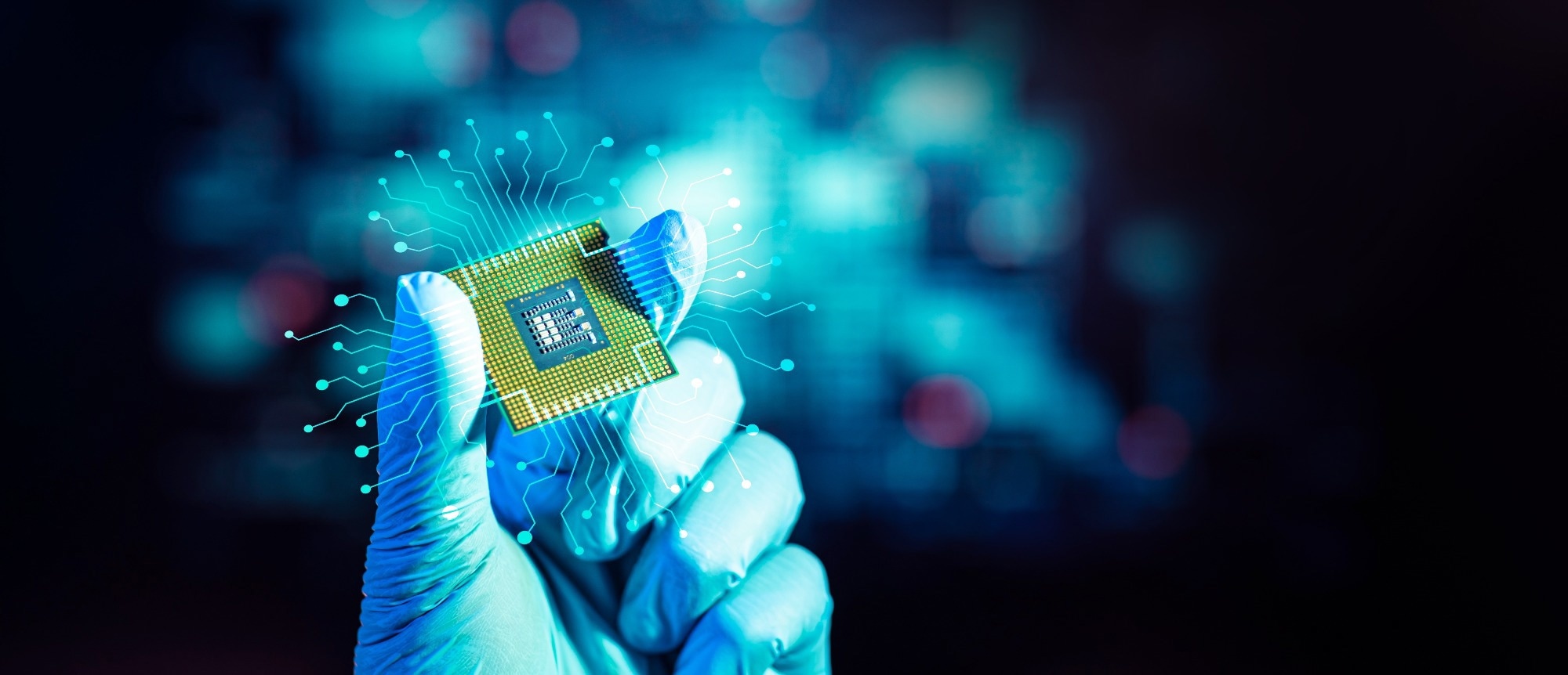 A scientist holding a quantum computing chip
