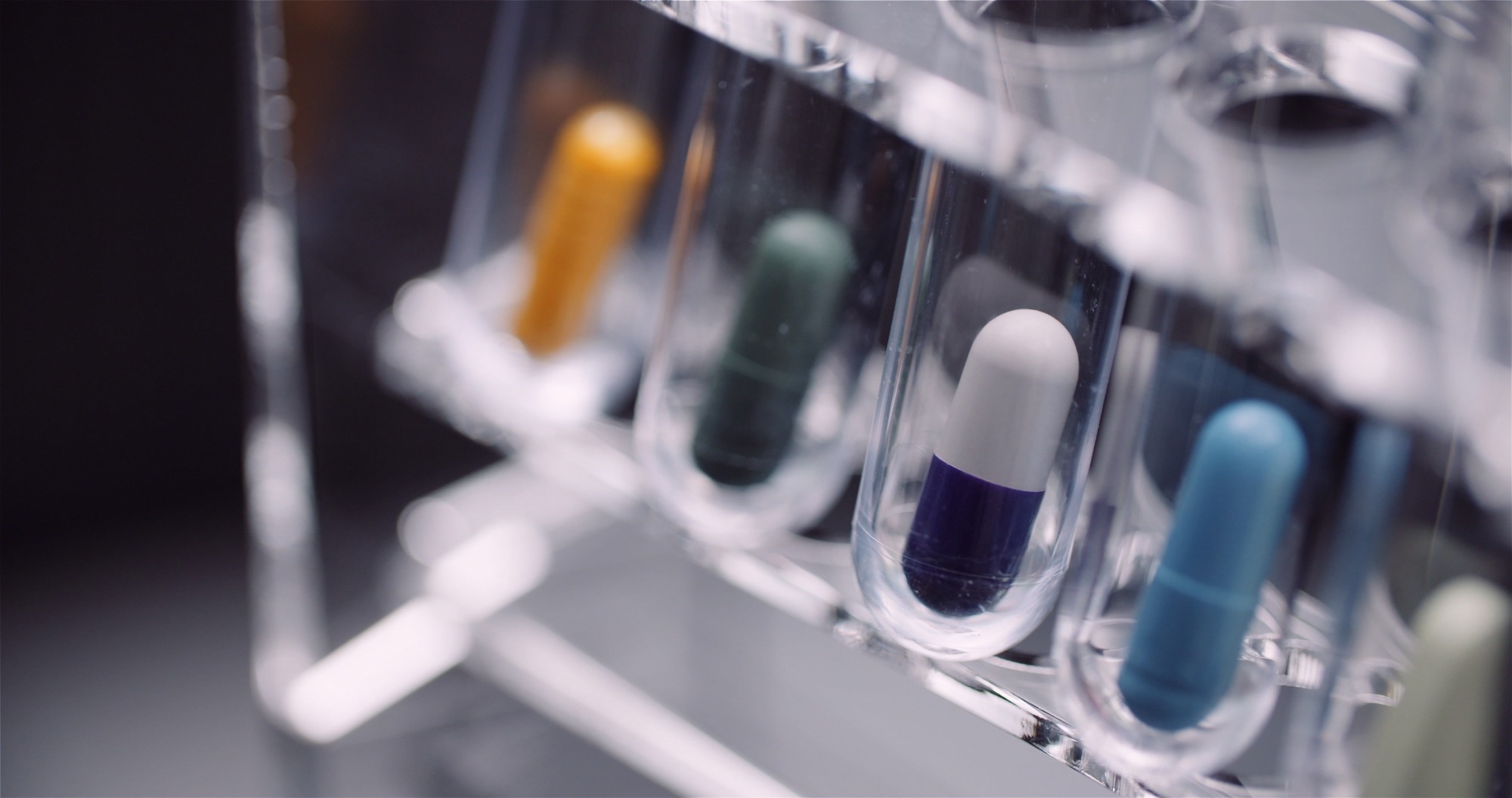 A picture of pills in test tubes