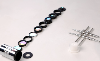 Custom Optics for Ion Trap Quantum Computing Experiments