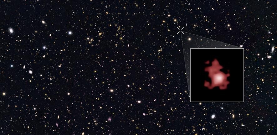 A Compact and Active Black Hole in the Early Universe