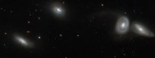 Hubble Images Gathering of Four Cosmic Companions