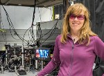 Special Quantum Features Improve Signal Contrast of Compact Cold Rubidium Atom Atomic Clock