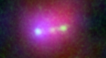 Rare Far-Flung Trio of Primitive Galaxies May Eventually Merge