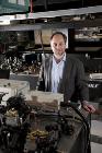 Theory of Interacting Parallel Worlds Challenges Foundations of Quantum Science