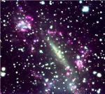 Closest Spectacular Galaxy Collision Discovered Behind the Milky Way