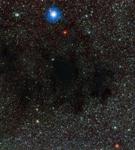 A Little Bit of Background Starlight Still Manages to Get Through Coalsack Nebula