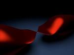 Two Materials with Unusual Quantum-Mechanical Properties Connected Through Quantum Constriction