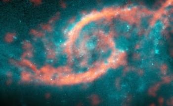 Collision of Two Distant Galaxies Produces Dazzling Arcs of Intense Star Formation