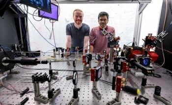 Combining Atom Arrays and Photonic Devices for Scalable Quantum Systems