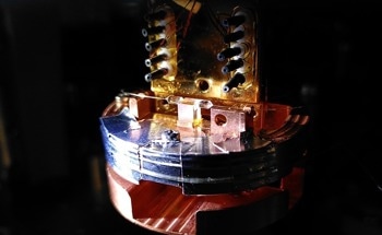 Quantum Memory Entangled with a Photon at Telecommunication Wavelength