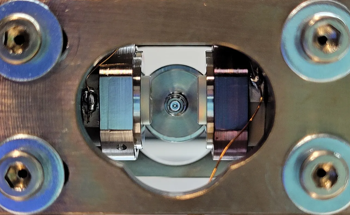 Cooling Down Tiny Glass Spheres' Motion in 2D